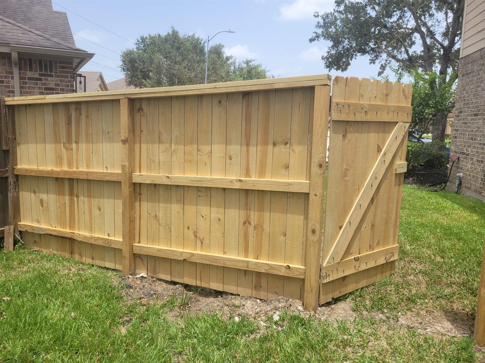 New cedar privacy fence with a matching gate