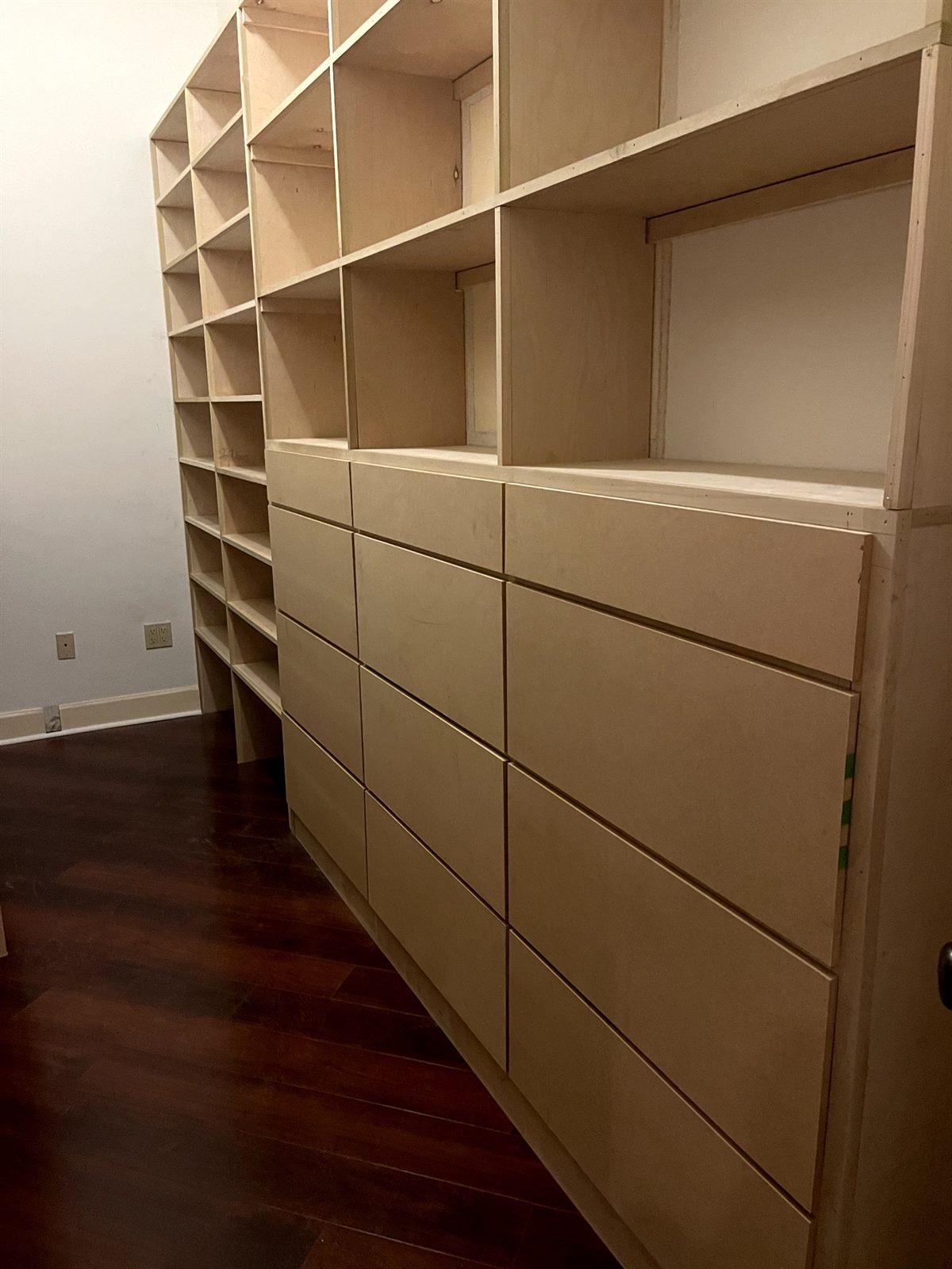 Custom walk-in closet with built-in shelving and drawers